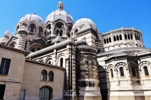 A low angle view of the Marseille Cathedral under the sunlight and a blue sky in France