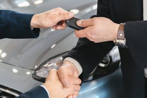 Photo by Antoni Shkraba on <a href="https://www.pexels.com/photo/close-up-of-men-shaking-hands-and-handing-in-keys-to-a-new-car-at-the-car-salon-7144212/" rel="nofollow">Pexels.com</a>